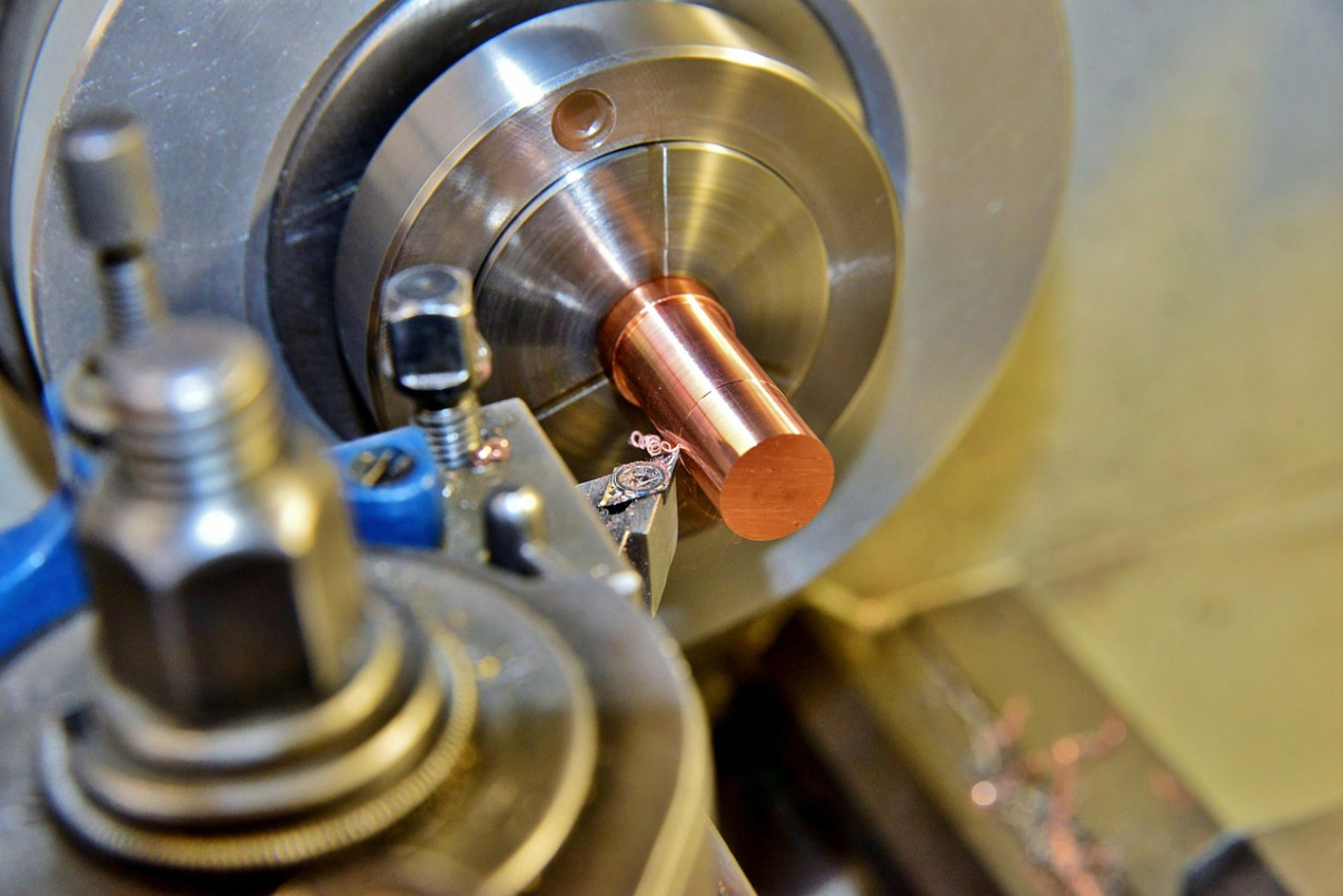 machinist working on lathe